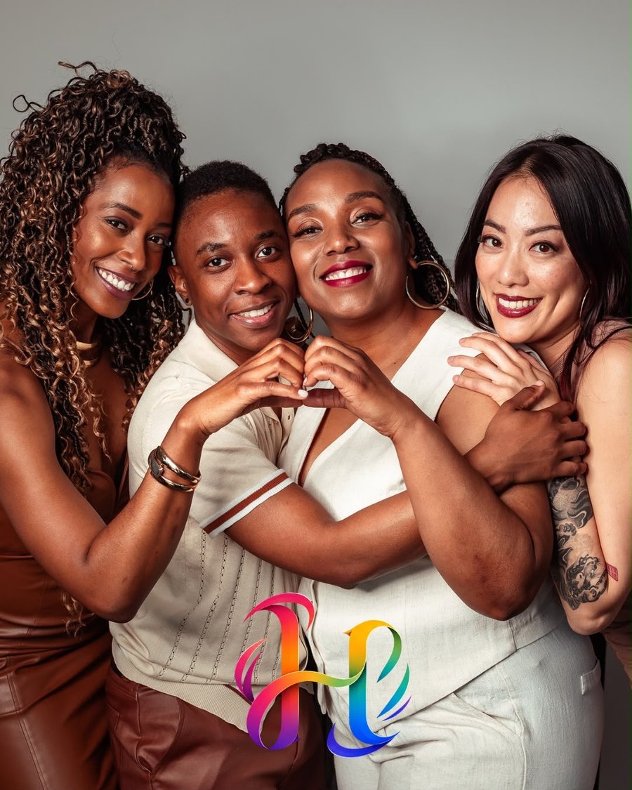 Haus of Hue community members embracing at an event